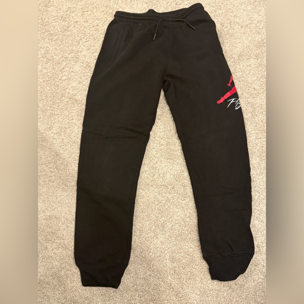 Black Air Jordan Sweatpants with Red and White Logo